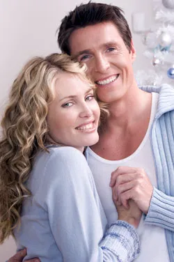 A man and woman smiling